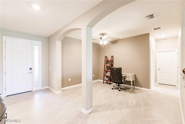 entryway featuring light tile patterned flooring and ceiling fan