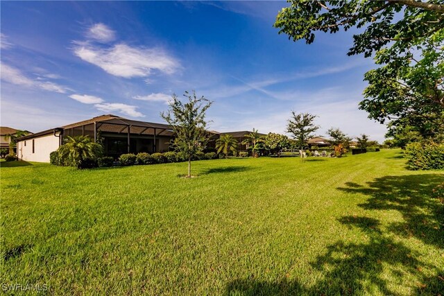 view of yard featuring a lanai