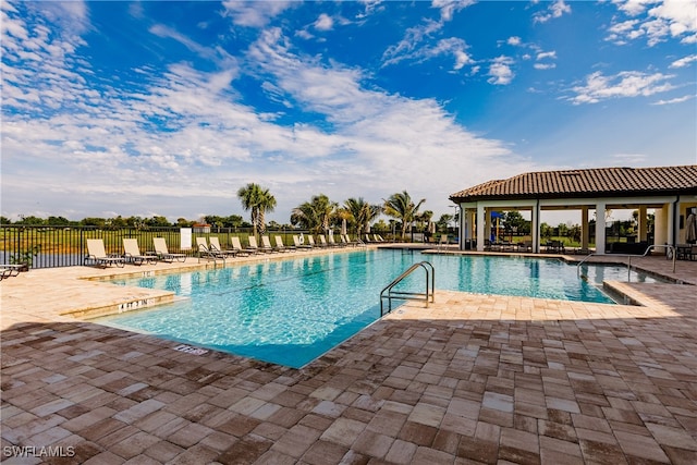 view of swimming pool with a patio