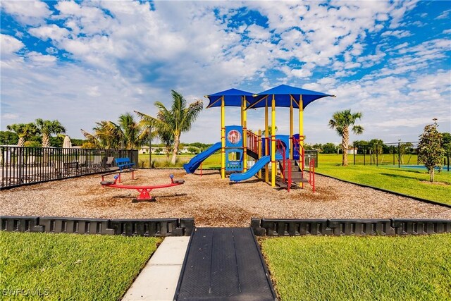 view of jungle gym with a lawn