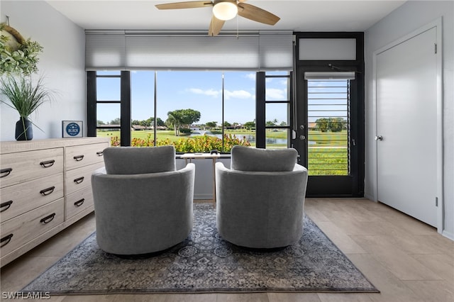 sitting room with ceiling fan