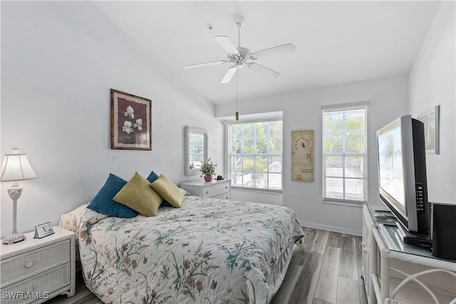 bedroom with light hardwood / wood-style flooring and ceiling fan