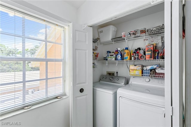 washroom with separate washer and dryer and plenty of natural light