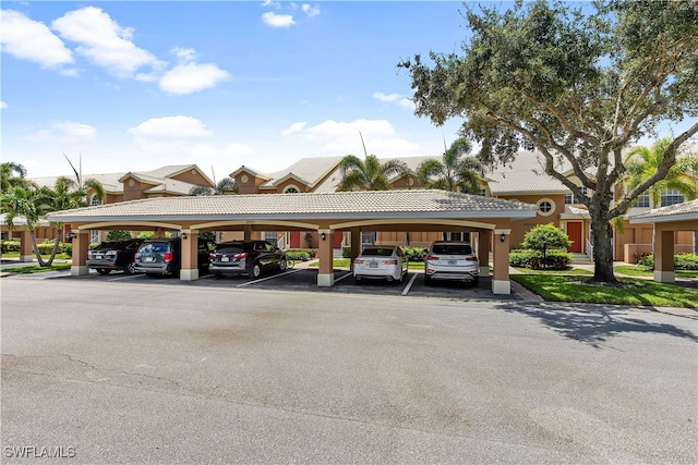 view of vehicle parking featuring a carport