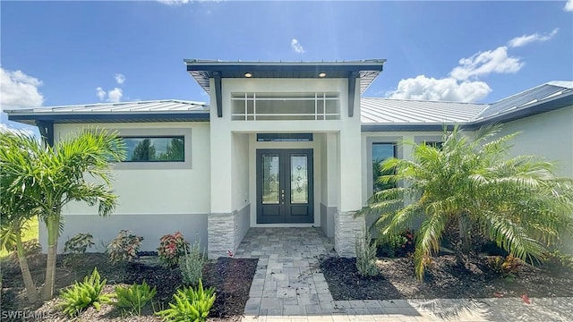 doorway to property featuring french doors