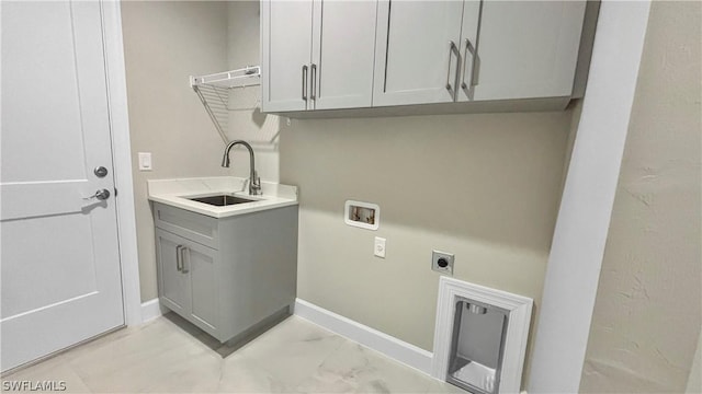 laundry area featuring sink, hookup for a washing machine, cabinets, and hookup for an electric dryer