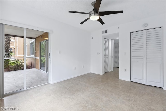 unfurnished bedroom featuring light tile patterned floors, ceiling fan, and access to exterior