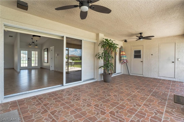 view of patio with french doors and ceiling fan