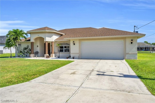 view of front of house with a garage and a front lawn