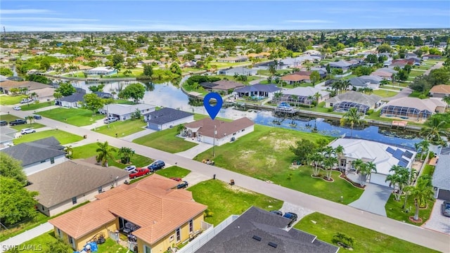 drone / aerial view with a water view