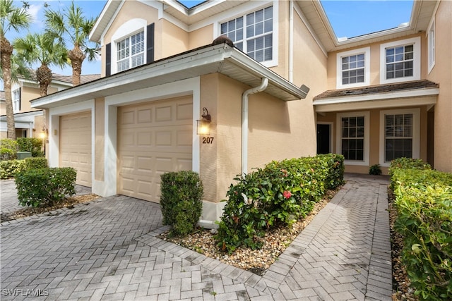 entrance to property featuring a garage