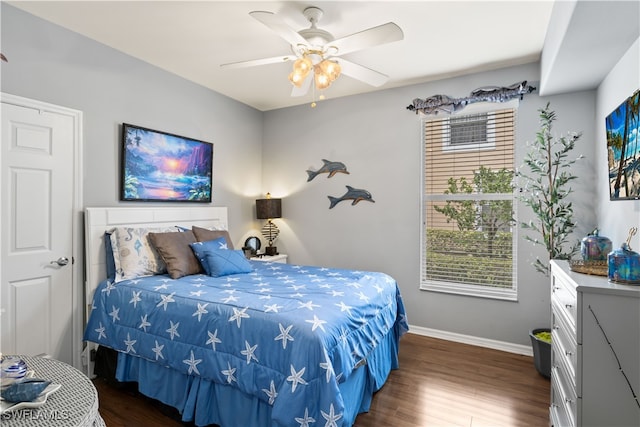 bedroom with ceiling fan and dark wood-type flooring