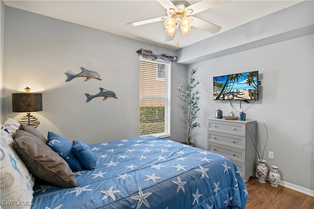 bedroom featuring hardwood / wood-style floors and ceiling fan