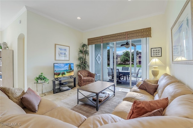 living room featuring ceiling fan and ornamental molding