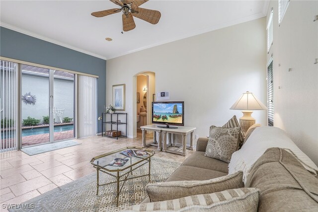 living room featuring ceiling fan and crown molding