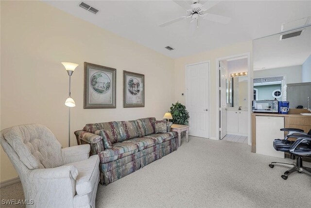 living room featuring light colored carpet and ceiling fan