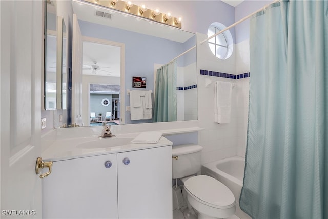 full bathroom featuring vanity, shower / bathtub combination with curtain, toilet, and ceiling fan