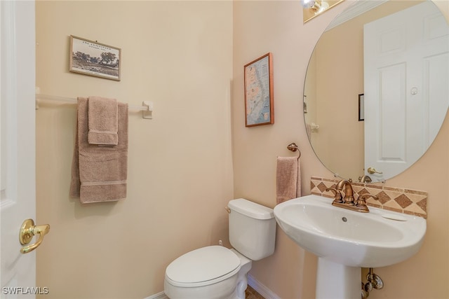 bathroom featuring sink and toilet