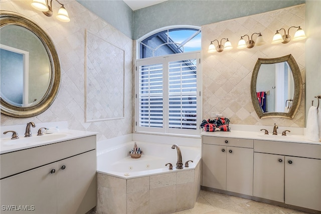 bathroom featuring tile patterned flooring, vanity, and a relaxing tiled tub