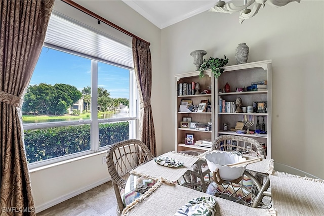 dining area featuring crown molding