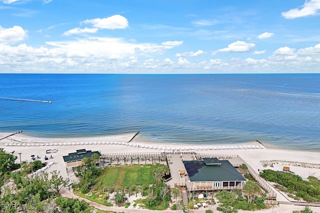 birds eye view of property featuring a water view and a view of the beach