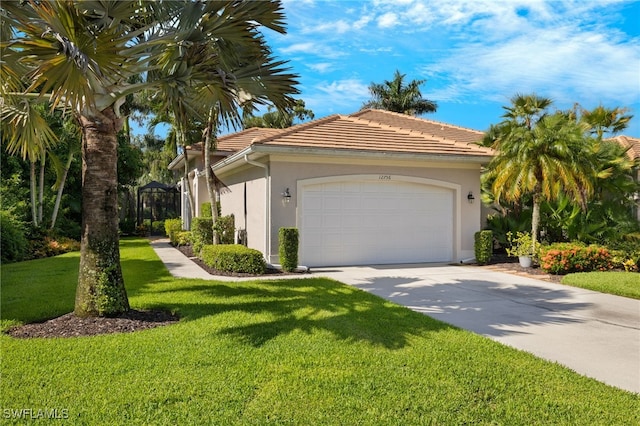 view of front of house with a garage and a front yard