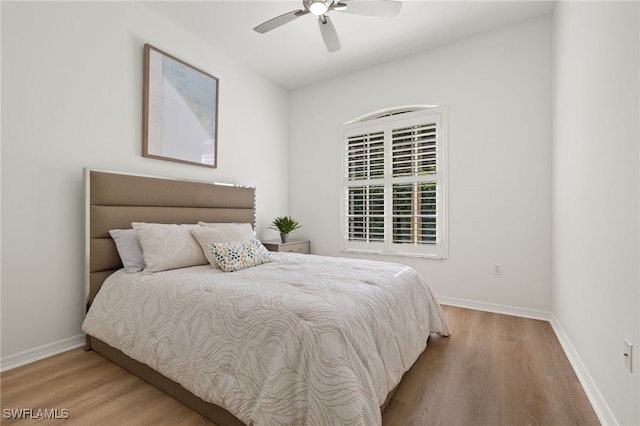 bedroom featuring light hardwood / wood-style flooring and ceiling fan