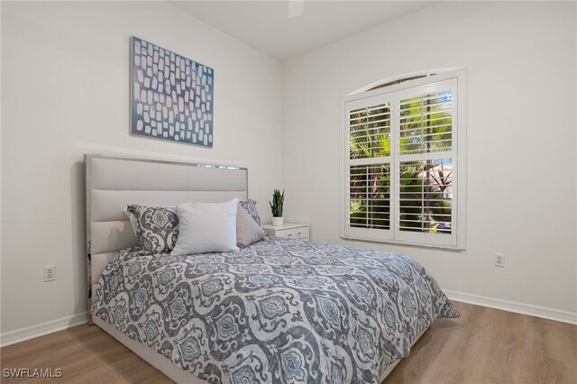 bedroom featuring ceiling fan and hardwood / wood-style flooring