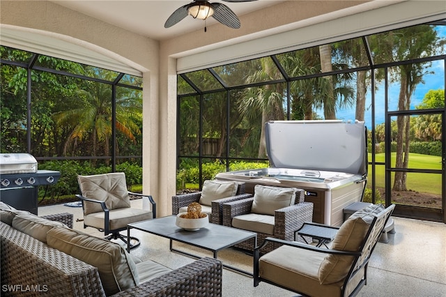 sunroom featuring ceiling fan