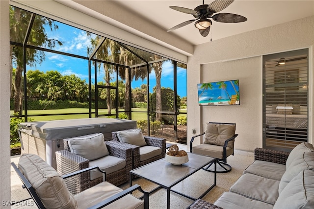 sunroom featuring ceiling fan