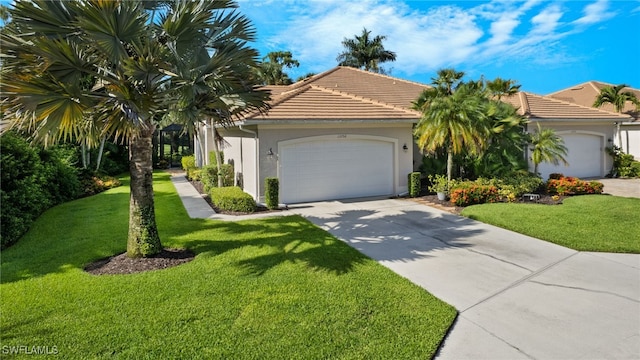 view of front of home with a garage and a front yard