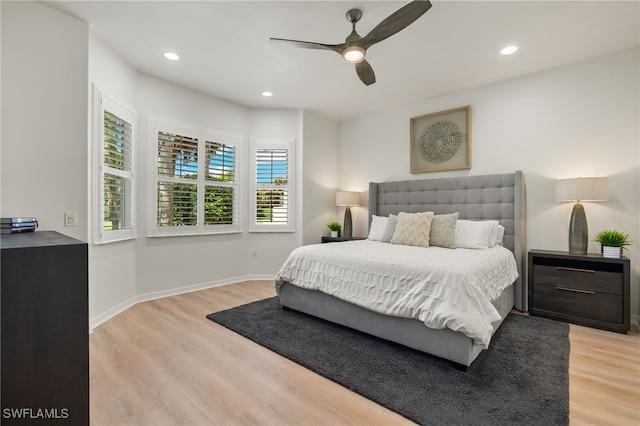 bedroom featuring ceiling fan and light hardwood / wood-style flooring