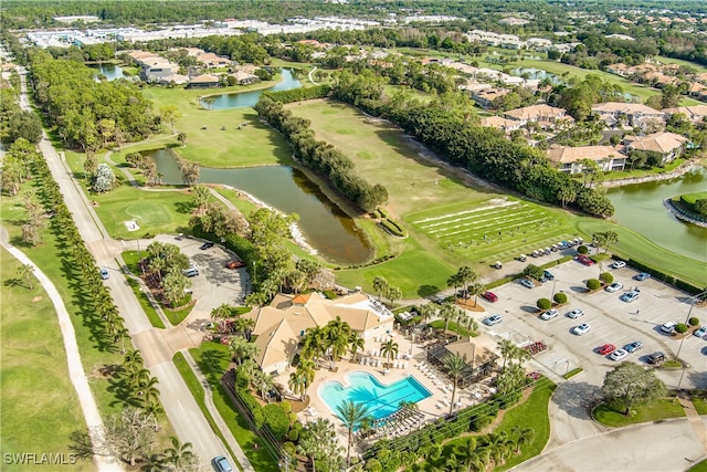 birds eye view of property with a water view