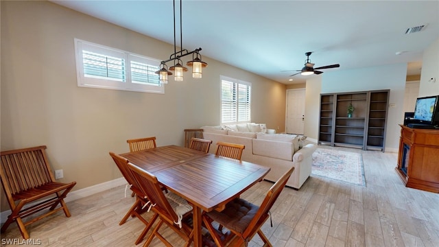 dining area featuring ceiling fan and light hardwood / wood-style floors