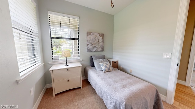 bedroom with light wood-type flooring