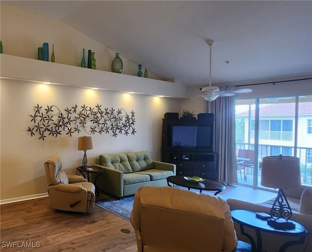 living room featuring hardwood / wood-style flooring and lofted ceiling