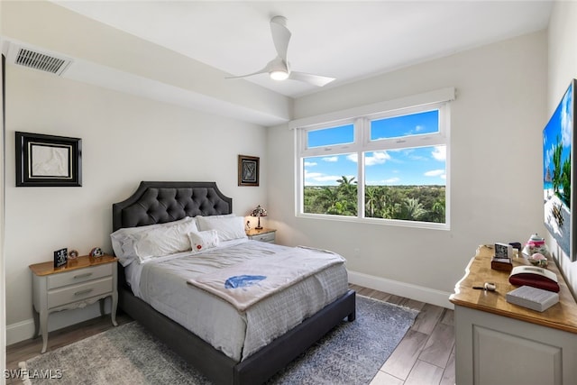 bedroom with ceiling fan and hardwood / wood-style flooring