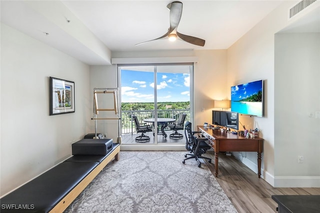 office space featuring wood-type flooring and ceiling fan