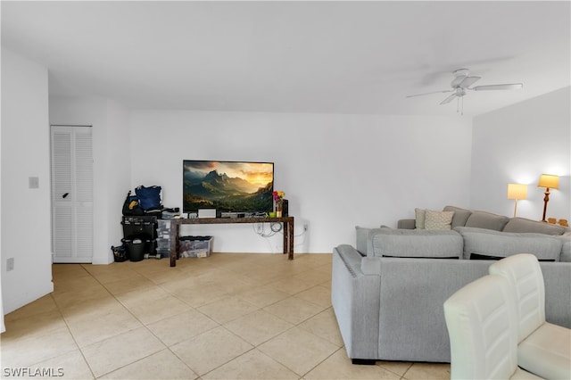 living room with light tile patterned flooring and ceiling fan