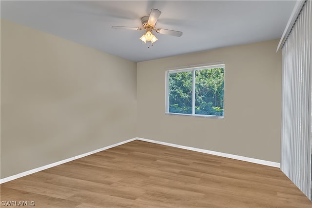 empty room featuring light wood-type flooring and ceiling fan