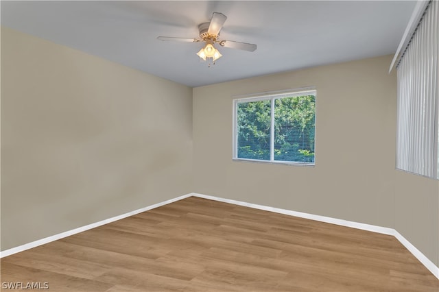 empty room with light hardwood / wood-style flooring and ceiling fan