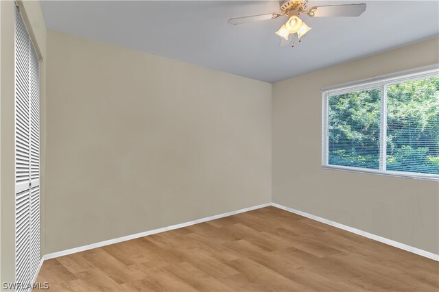 unfurnished room featuring wood-type flooring and ceiling fan