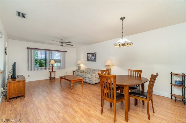 dining space featuring light hardwood / wood-style floors and ceiling fan