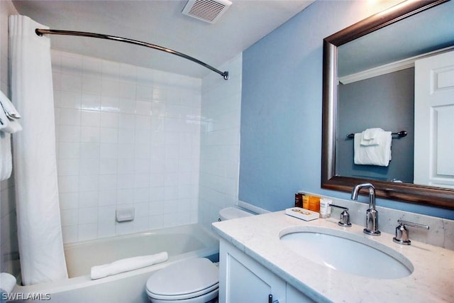 full bathroom featuring toilet, shower / bath combo with shower curtain, vanity, and visible vents
