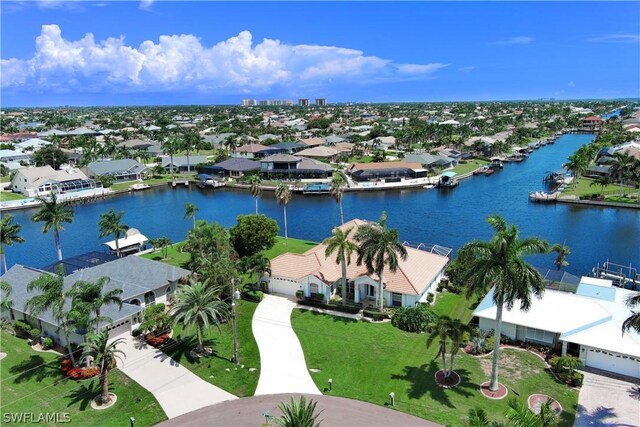 birds eye view of property with a water view