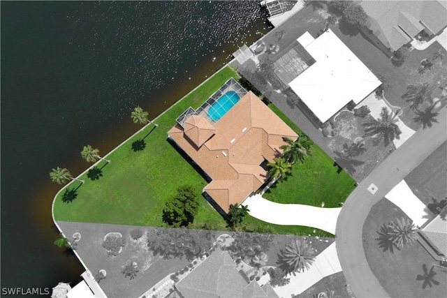 birds eye view of property with a water view