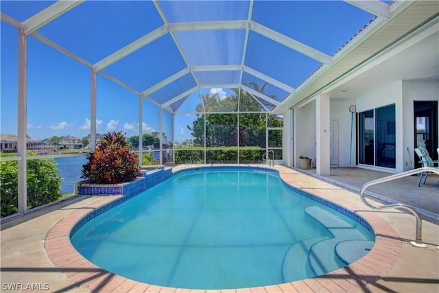 view of swimming pool with a water view, a lanai, and a patio area