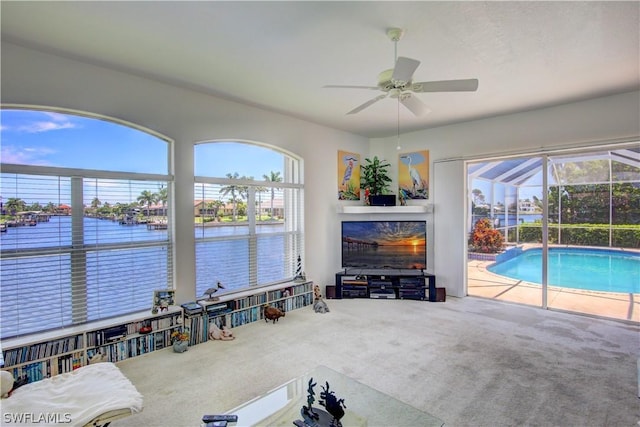 view of swimming pool featuring ceiling fan