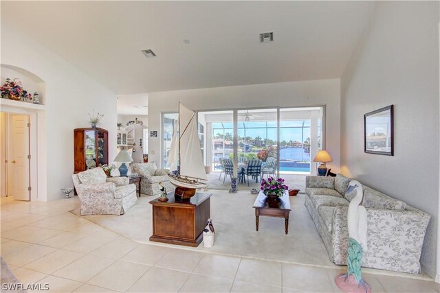 tiled living room featuring ceiling fan