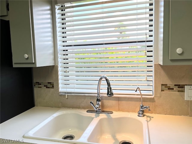 details with sink and green cabinetry